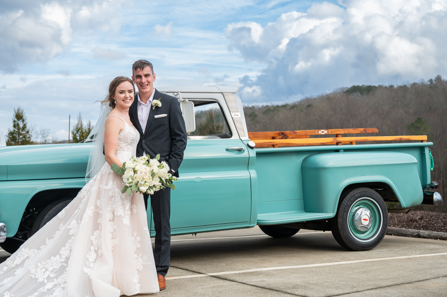 bride and groom in front of truck at The Greystone Estate Wedding Venue